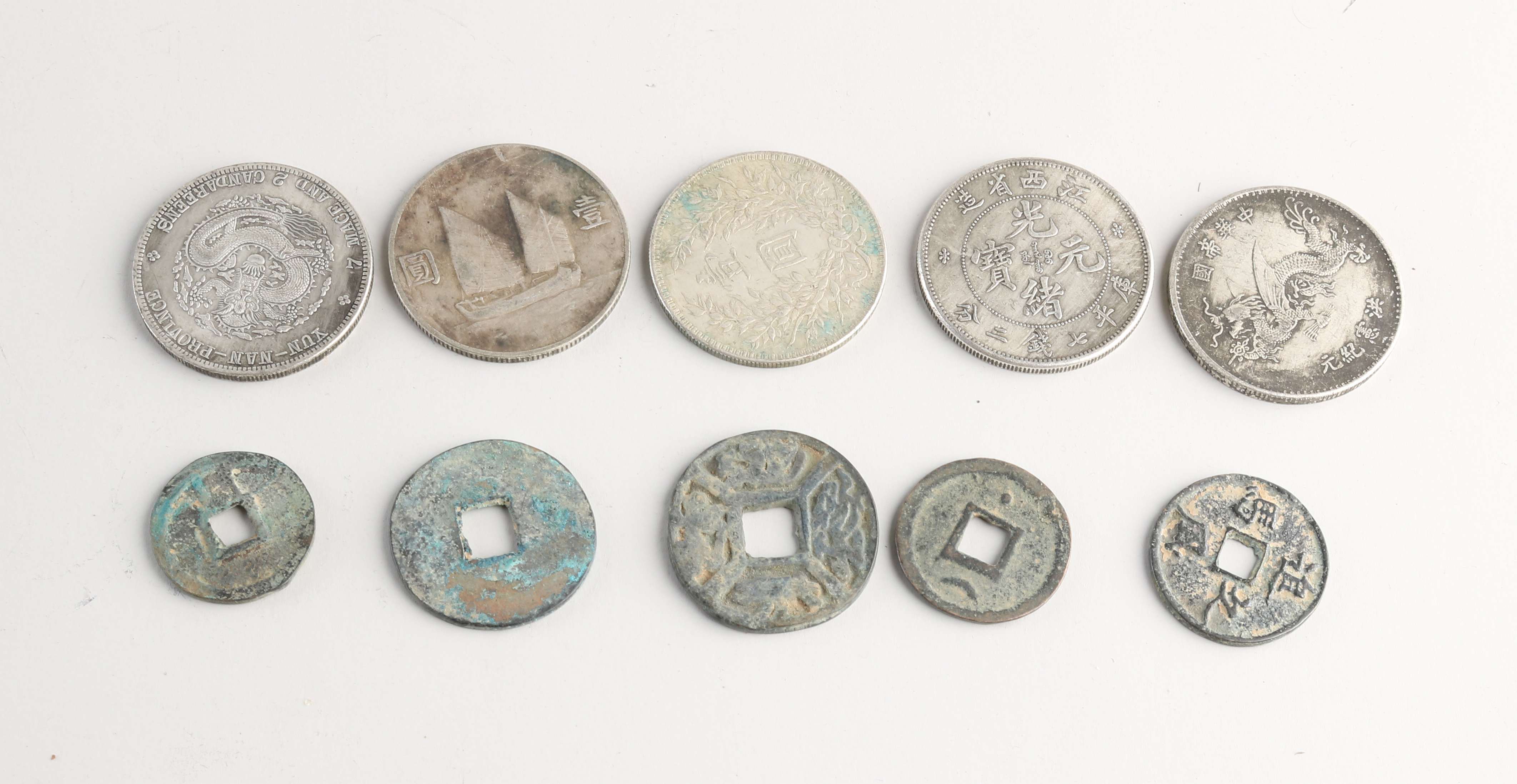 Tien oude Chinese munten